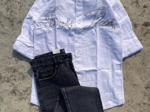🤍🖤 White Louis Vuitton Shirt with Embroidered Lettering & Black Denim Jeans – Luxury Meets Casual